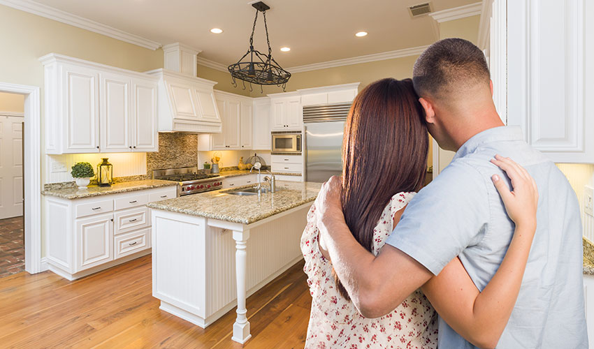 Photo of man and woman inside their home